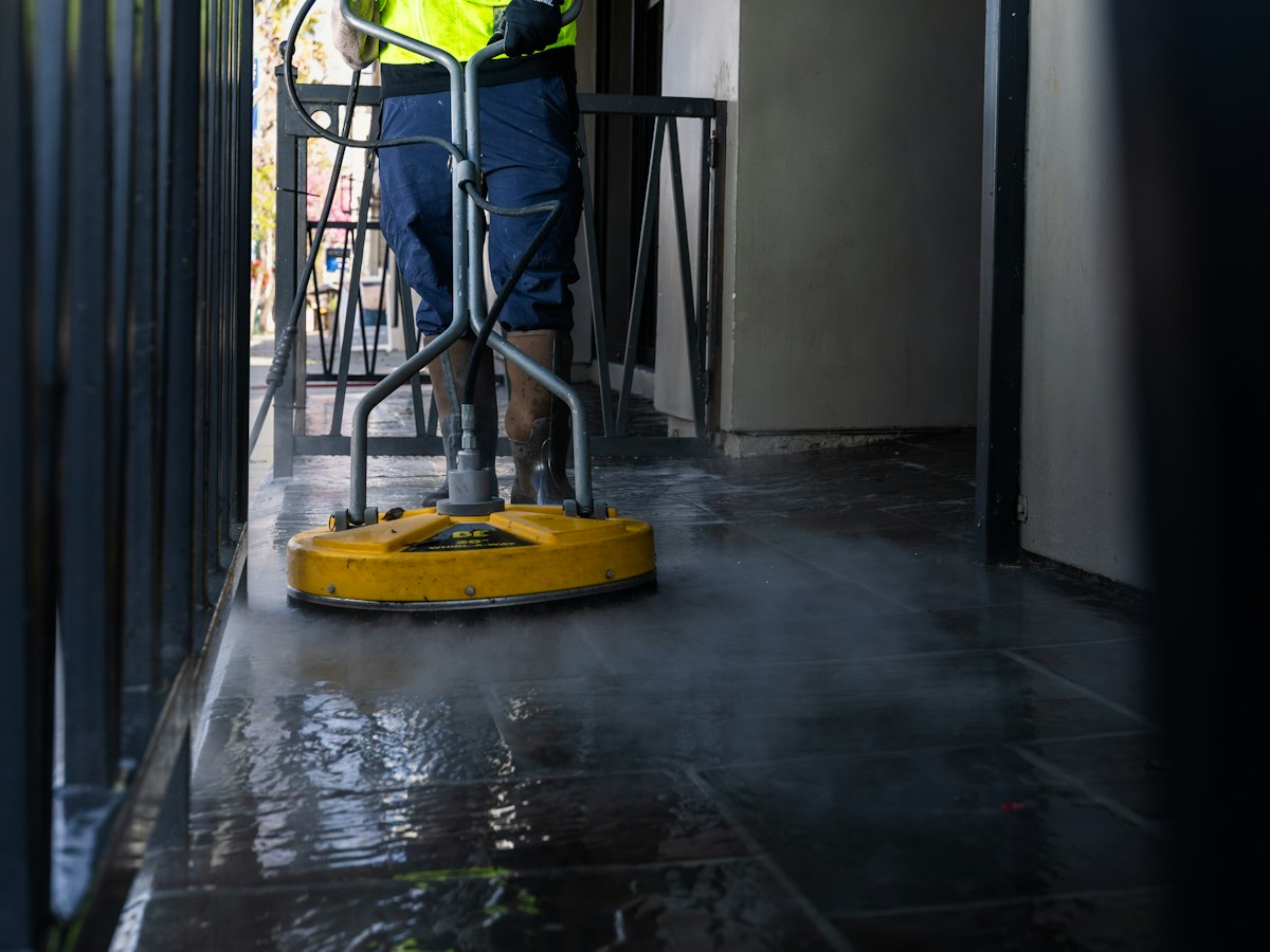 Floor being machine-scrubbed during final construction clean up